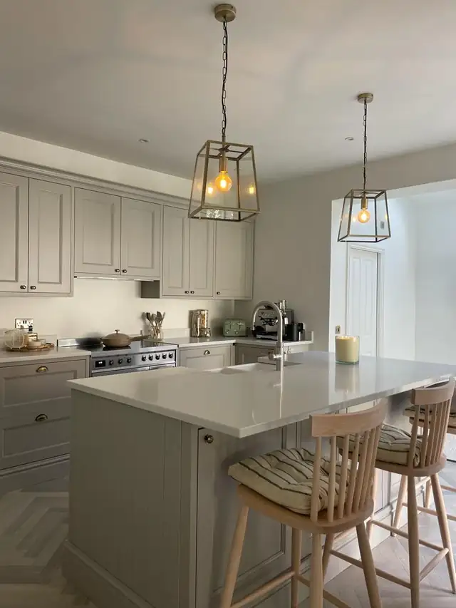 Kitchen island with pendant lights and bar stools